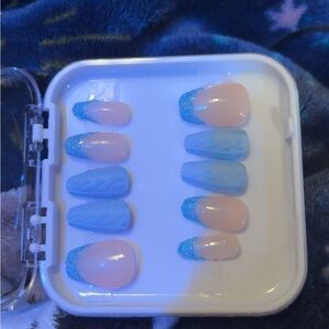 Blue and Nude Press-On Nails with sweater design and glitter